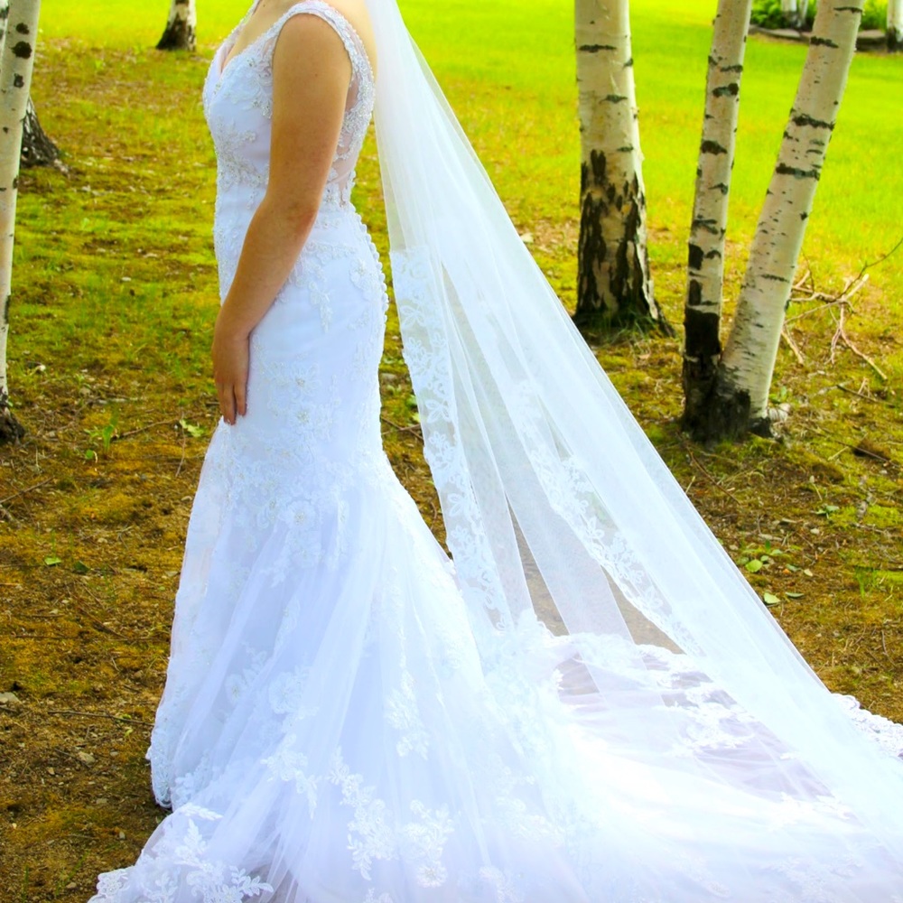 Wedding dress from blush boutique. Size 0 has been taken in
